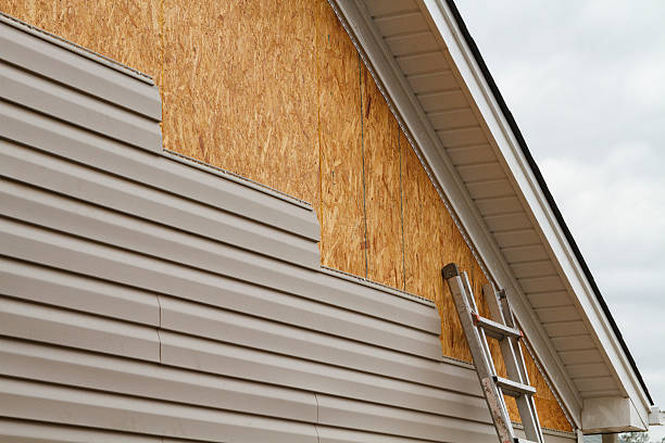 Professional Vinyl Siding technician working in Huntington, NY